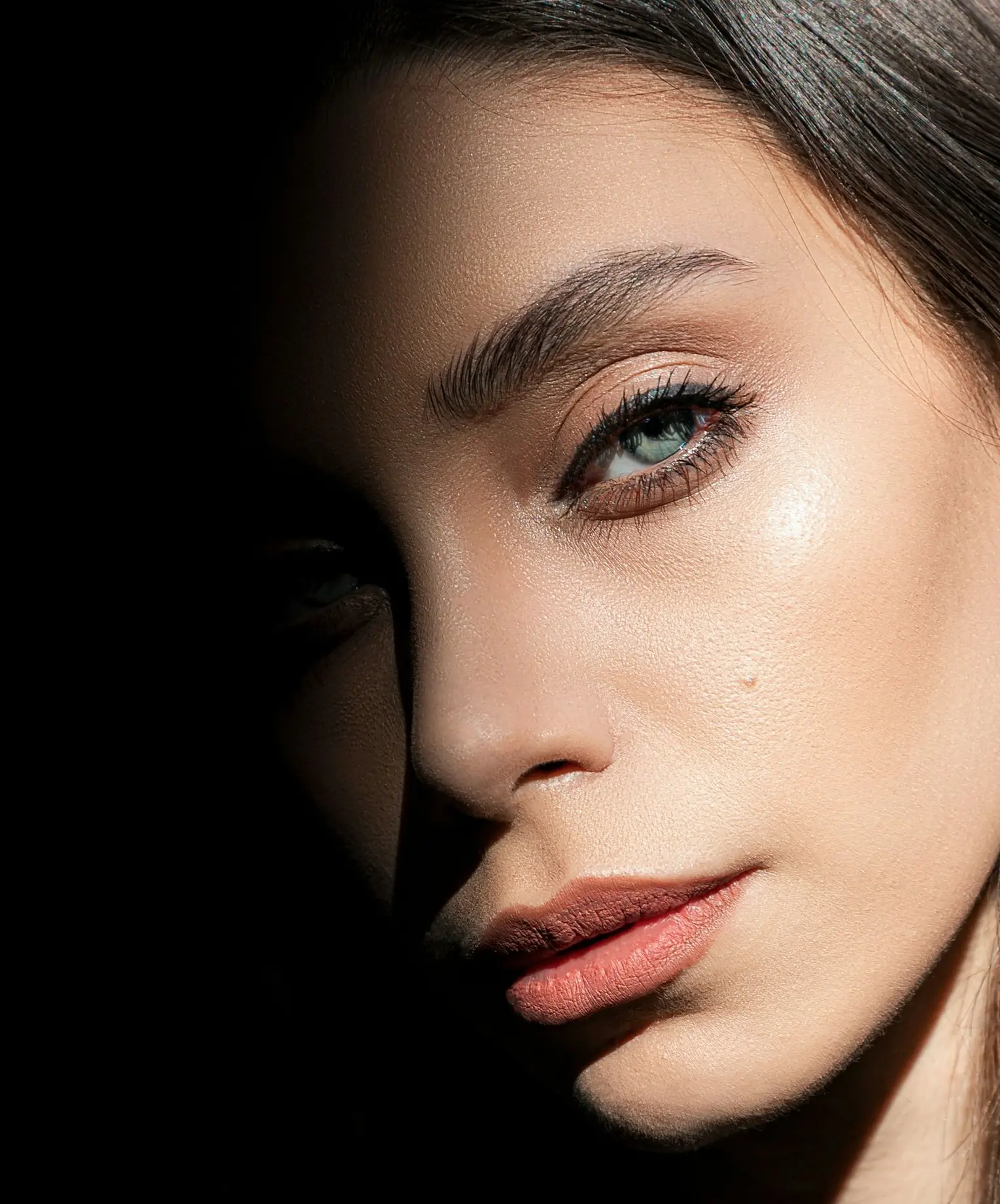 woman with red lipstick and black mascara